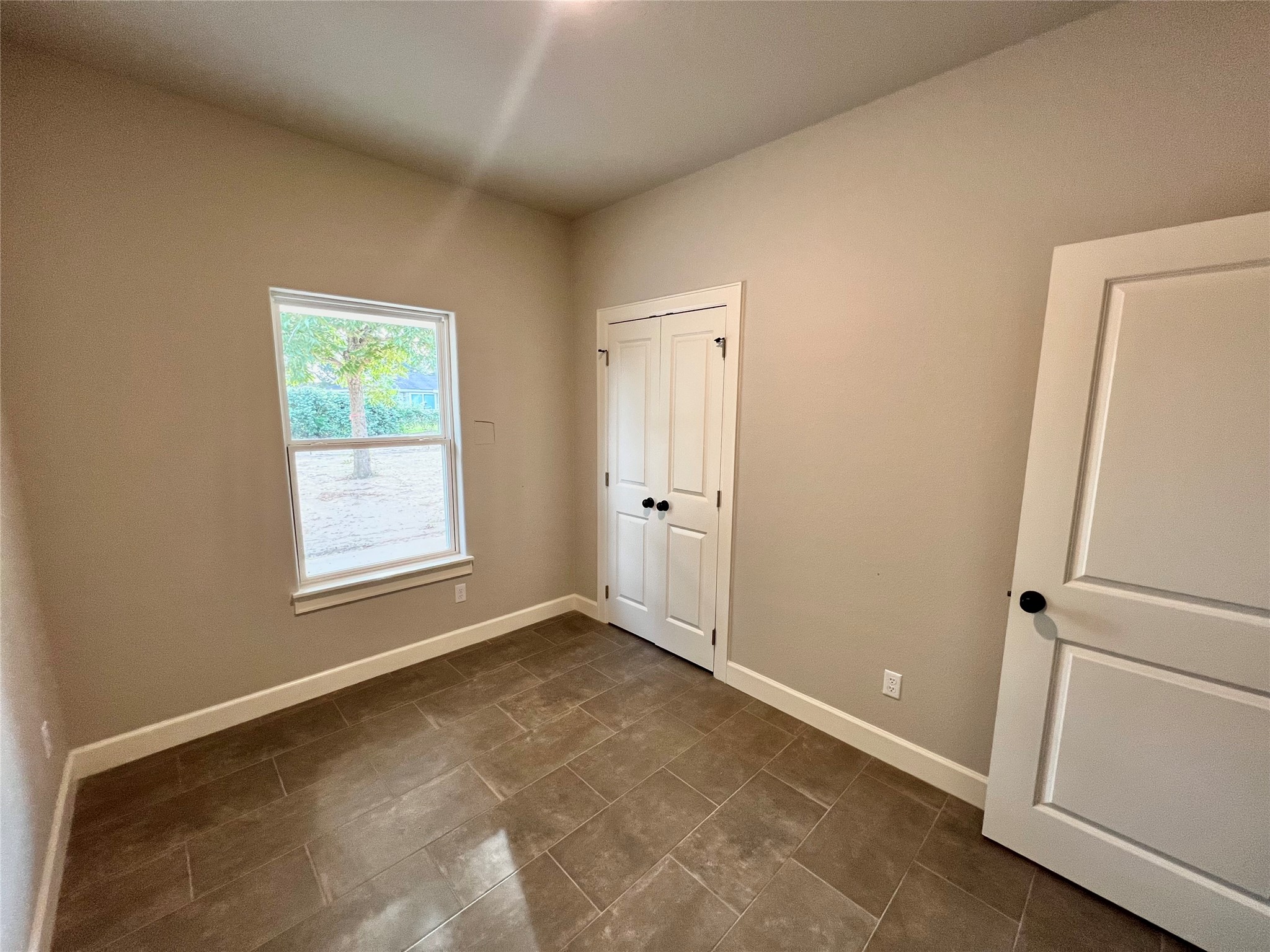 1007 South Anderson Street Angleton, TX 77515 - Photo 16 of 18 a view of an empty room with a window