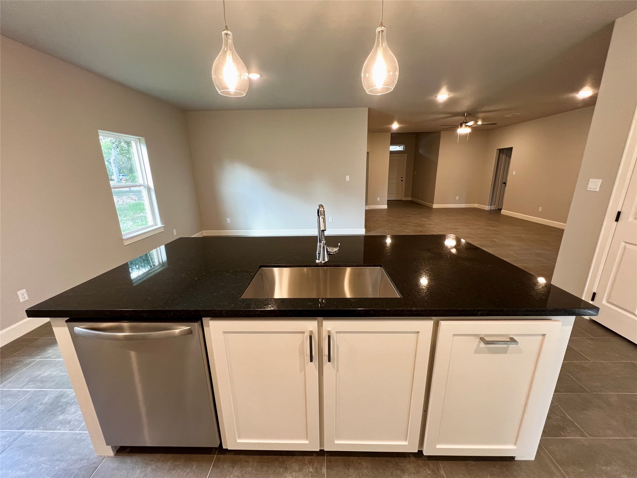 1007 South Anderson Street Angleton, TX 77515 - Photo 6 of 18 a kitchen with a sink and cabinets