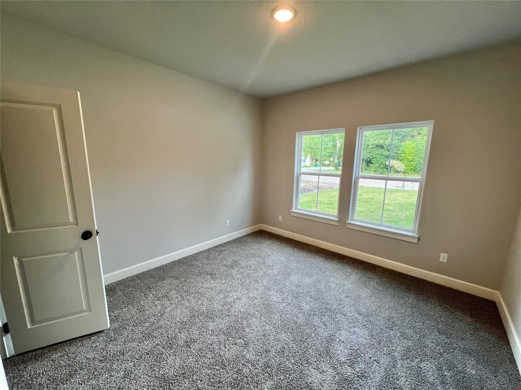 1007 South Anderson Street Angleton, TX 77515 - Photo 10 of 18 an empty room with windows