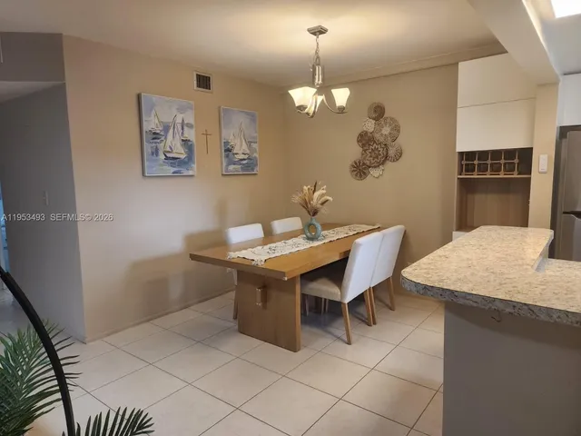 a kitchen with a sink and a microwave