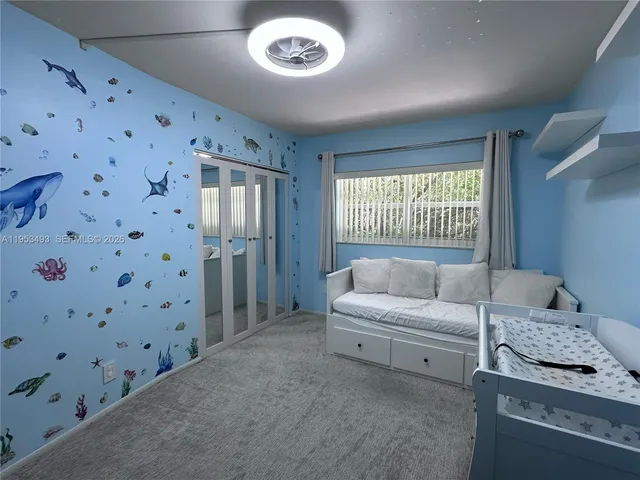 a room with a bed and a chair