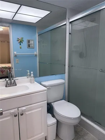 a close view of a utility room with dryer and washer