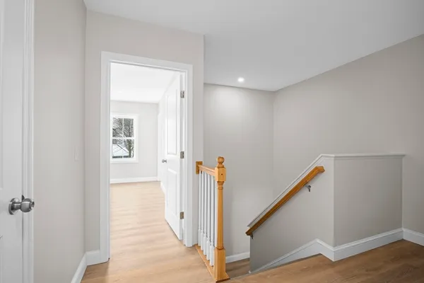 a view of a hallway with hallway and stairs