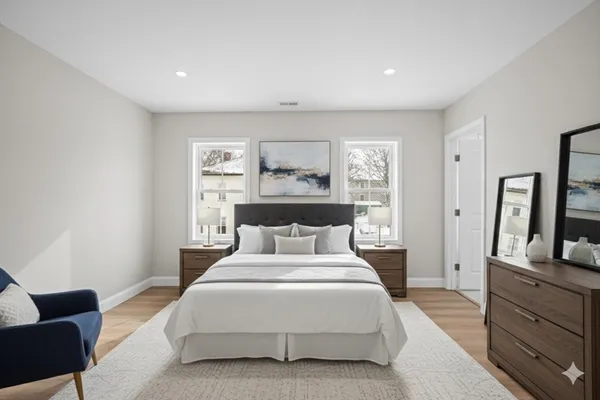 a bedroom with a bed and a television