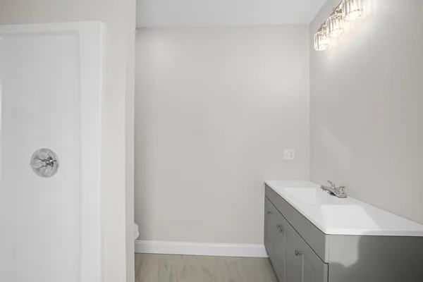 a bathroom with a sink and mirror