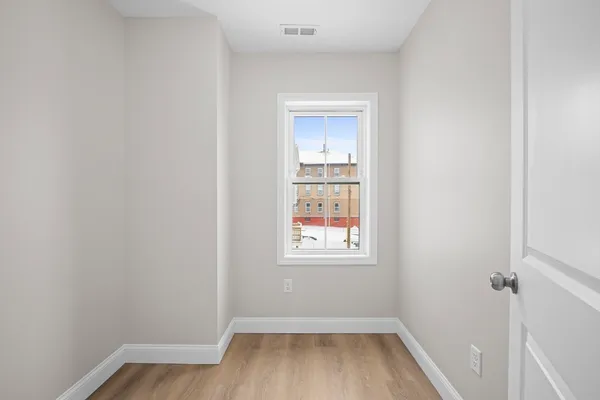 a view of a room that has a window in it