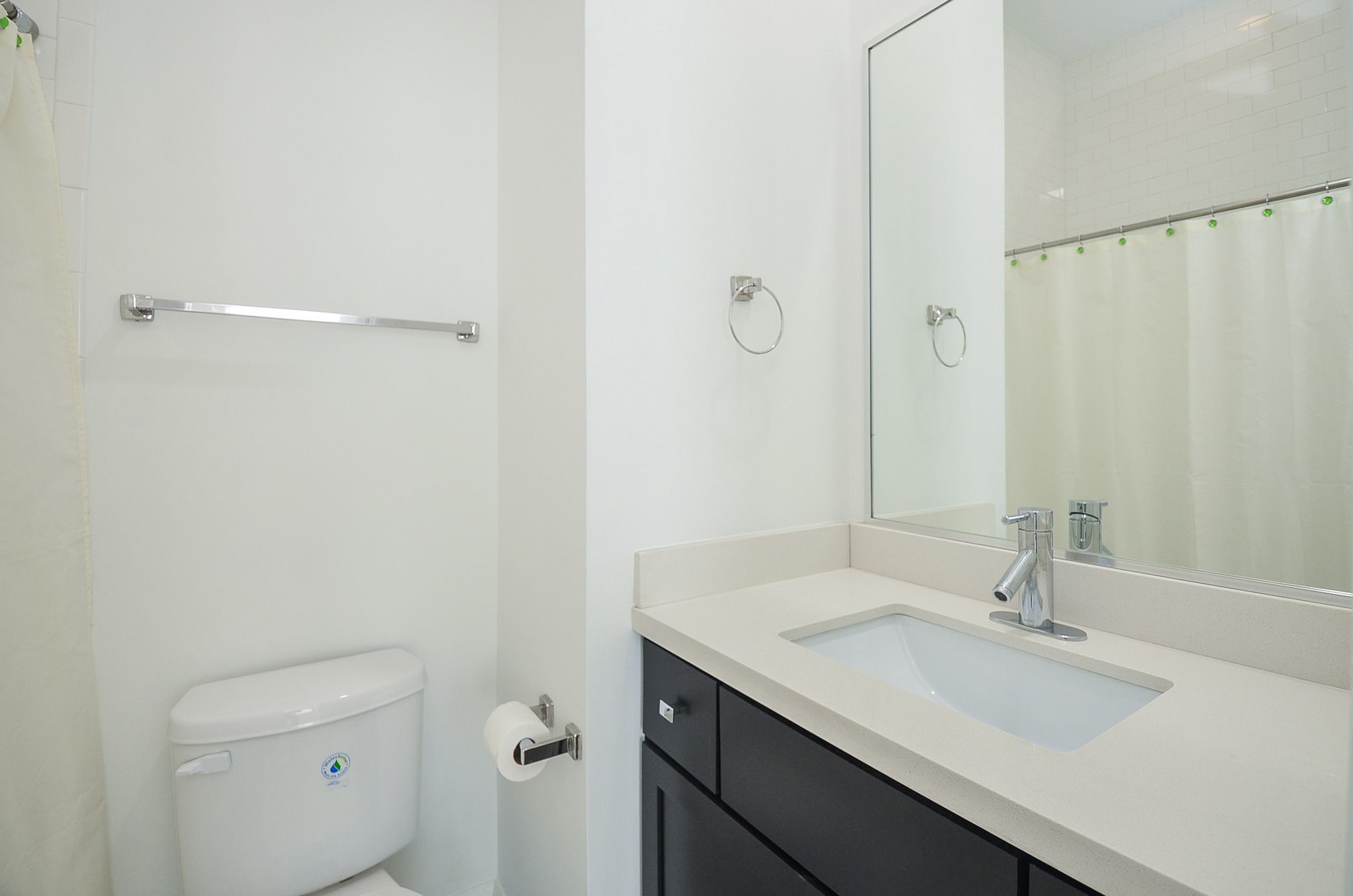 1245A Bonner Street, Unit B Houston, TX 77007 - Photo 11 of 36 a bathroom with a sink a toilet and a mirror