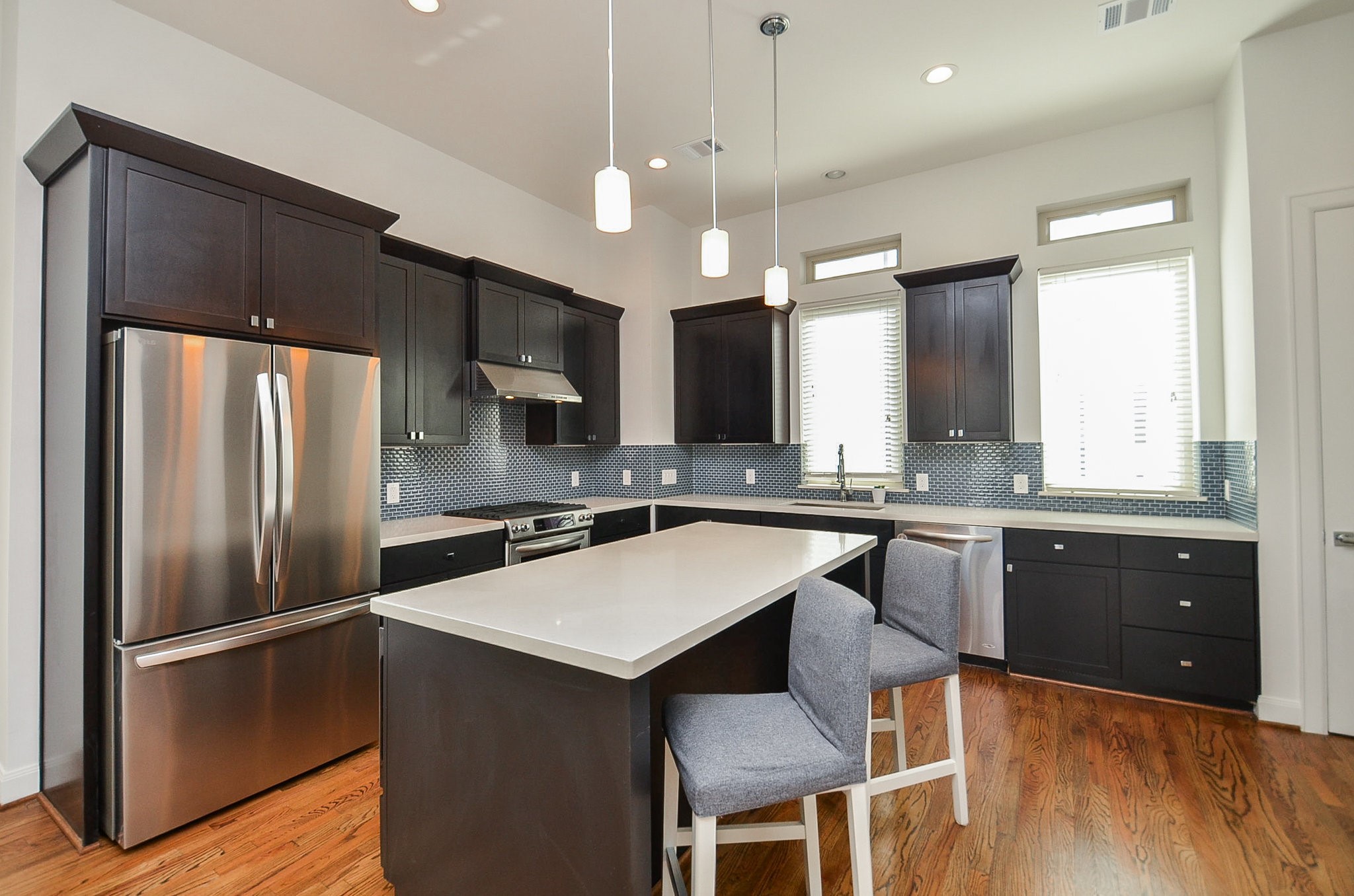1245A Bonner Street, Unit B Houston, TX 77007 - Photo 13 of 36 a kitchen with a refrigerator a sink dishwasher a stove and a refrigerator