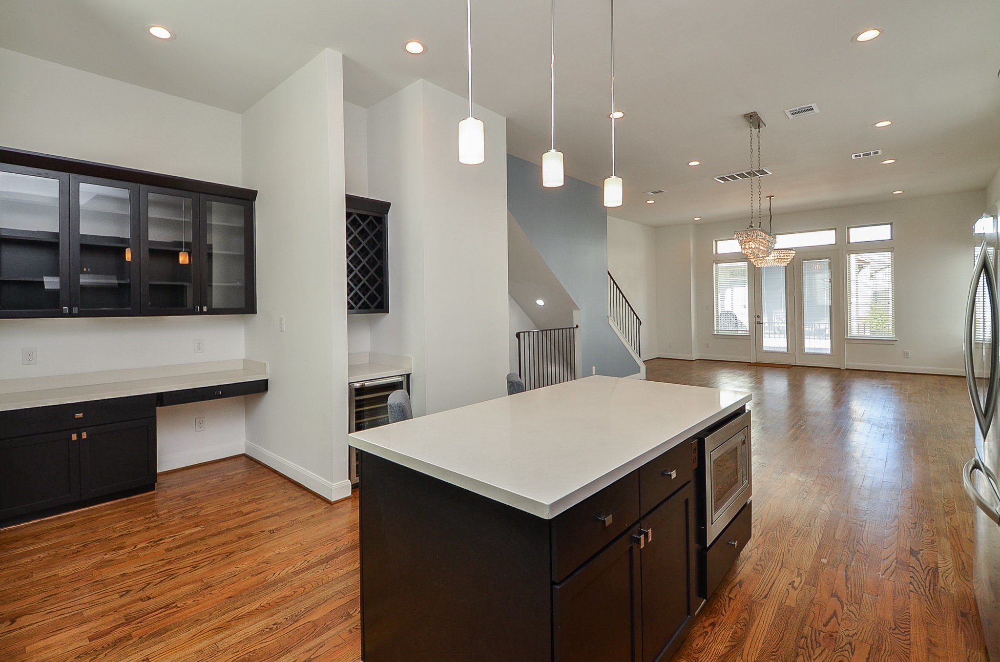 1245A Bonner Street, Unit B Houston, TX 77007 - Photo 14 of 36 a kitchen with a wooden floor and a kitchen island