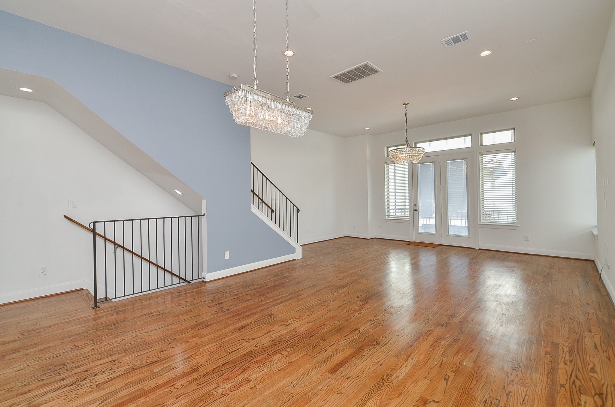 1245A Bonner Street, Unit B Houston, TX 77007 - Photo 18 of 36 a view of an empty room with wooden floor and a window