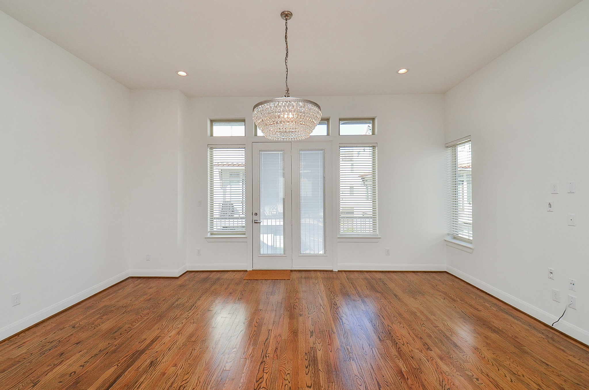 1245A Bonner Street, Unit B Houston, TX 77007 - Photo 19 of 36 a view of wooden floor chandelier and window in a room