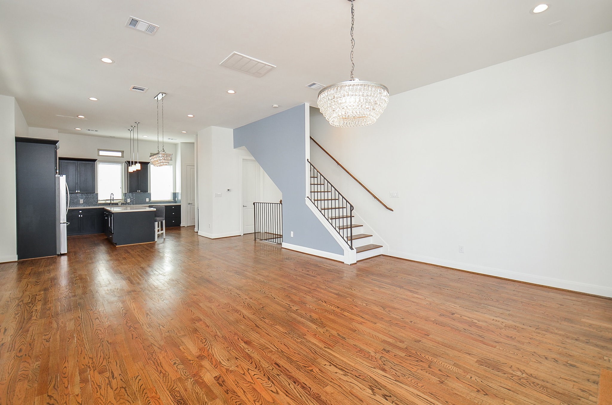 1245A Bonner Street, Unit B Houston, TX 77007 - Photo 20 of 36 a view of kitchen and hall with wooden floor