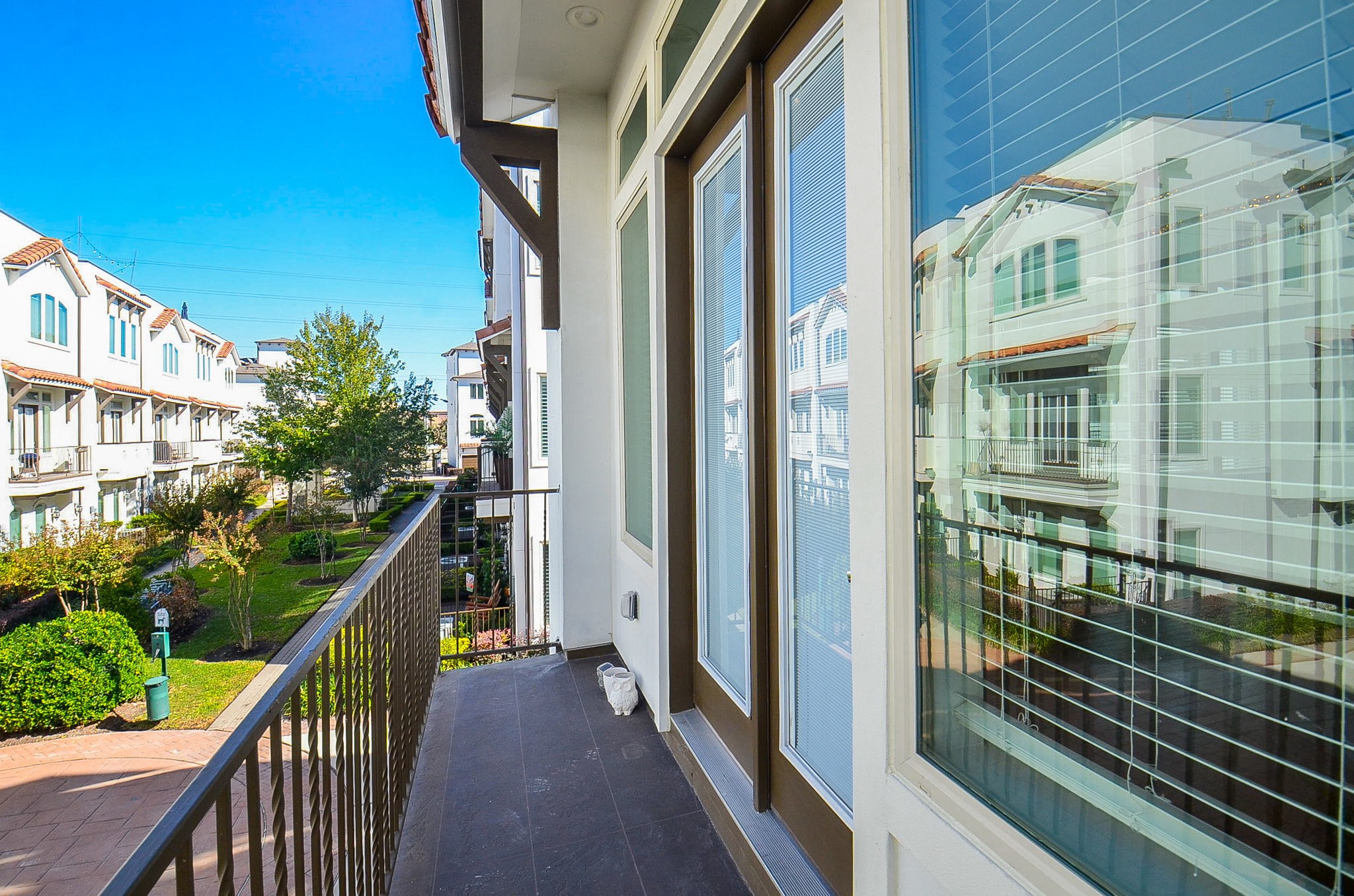 1245A Bonner Street, Unit B Houston, TX 77007 - Photo 22 of 36 a view of balcony with floor to ceiling windows and stairs