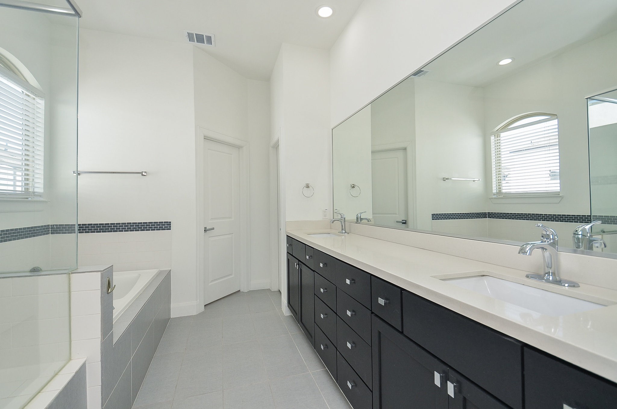 1245A Bonner Street, Unit B Houston, TX 77007 - Photo 29 of 36 a bathroom with a double vanity sink and mirror