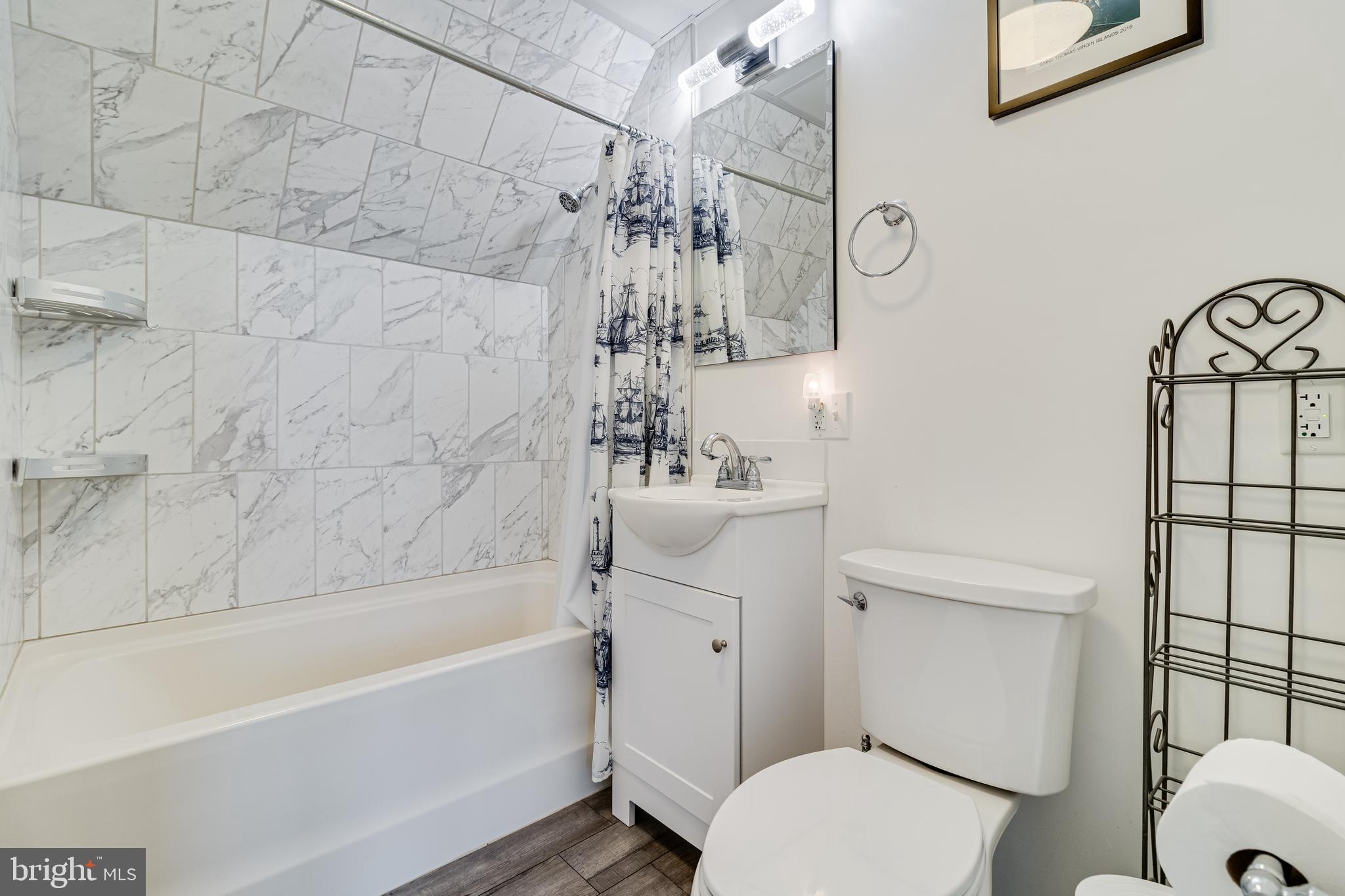 12015 Woodbury Road Nanjemoy, MD 20662 - Photo 11 of 53 a bathroom with a sink a toilet and shower