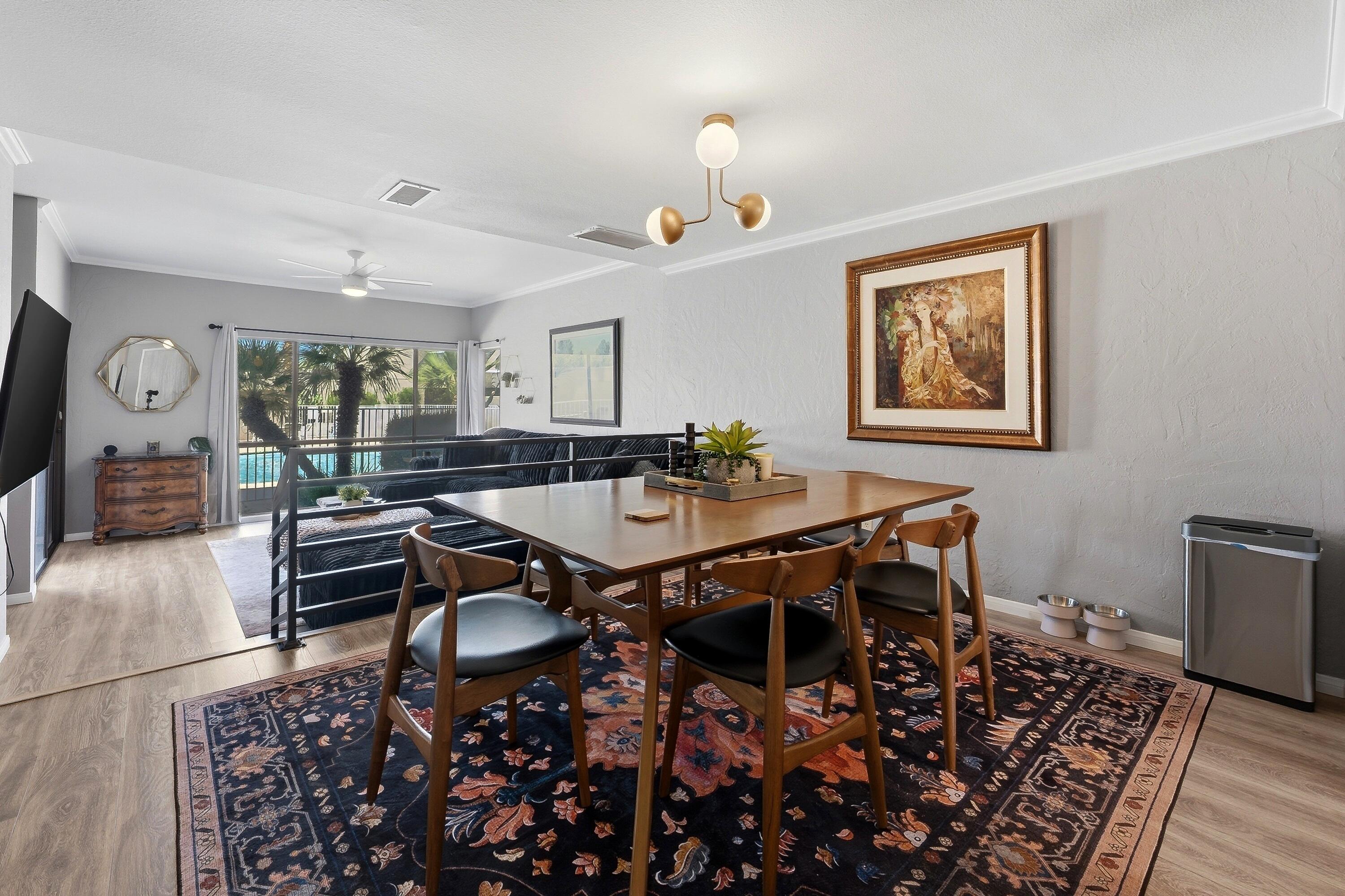 71870 Eleanora Lane Rancho Mirage, CA 92270 - Photo 3 of 36 a dining room with wooden floor a chandelier
