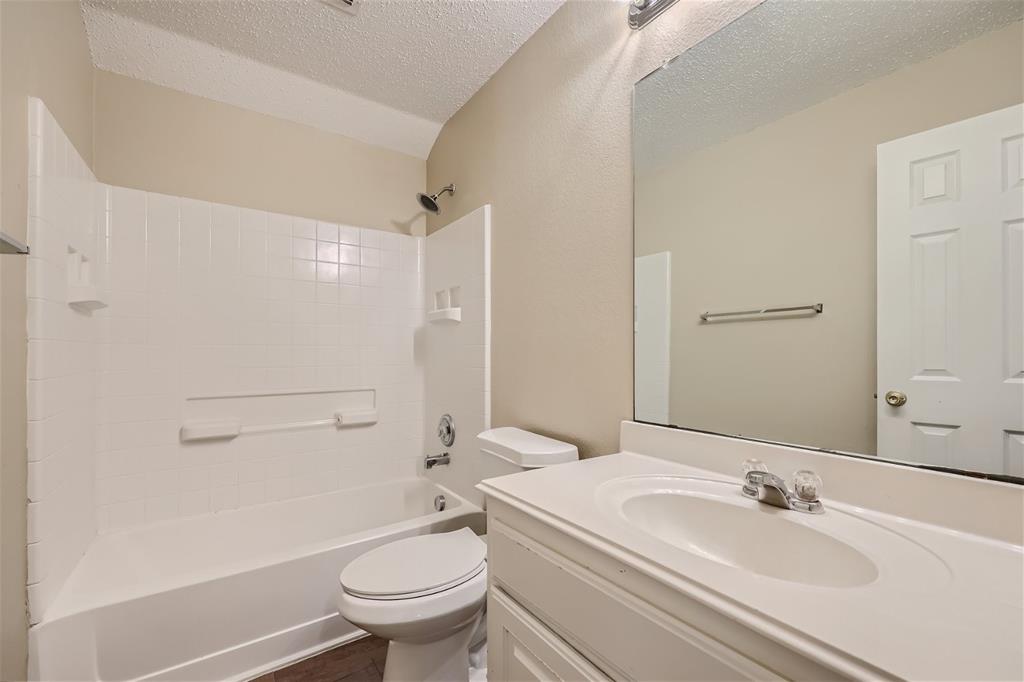 2210 Sumac Drive Forney, TX 75126 - Photo 18 of 20 a bathroom with a sink toilet and a mirror