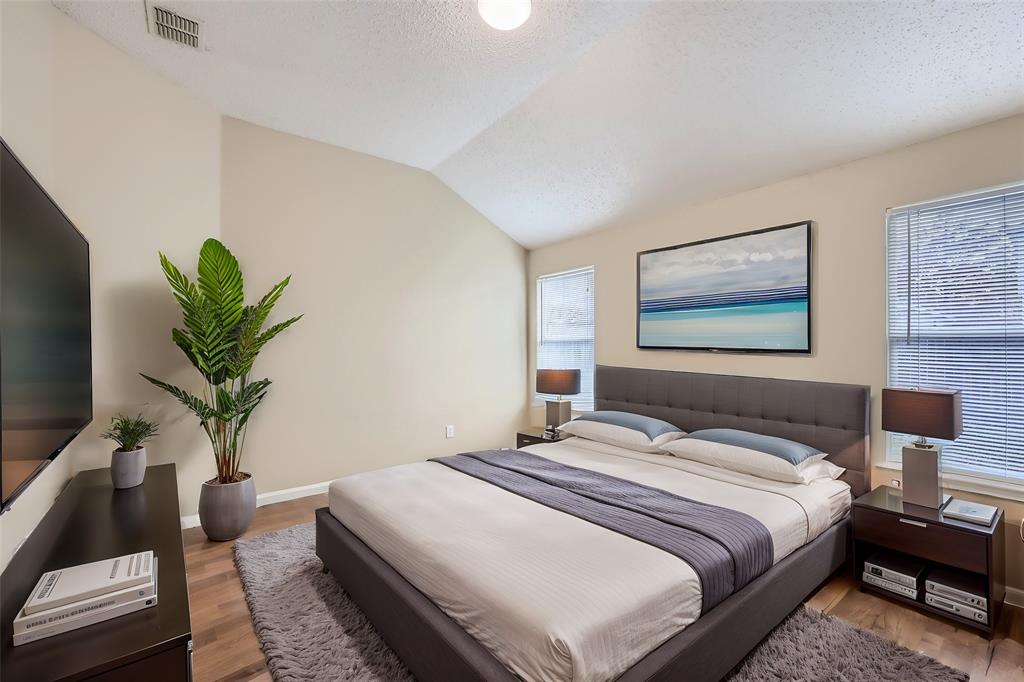 2210 Sumac Drive Forney, TX 75126 - Photo 9 of 20 a bedroom with bed and a potted plant