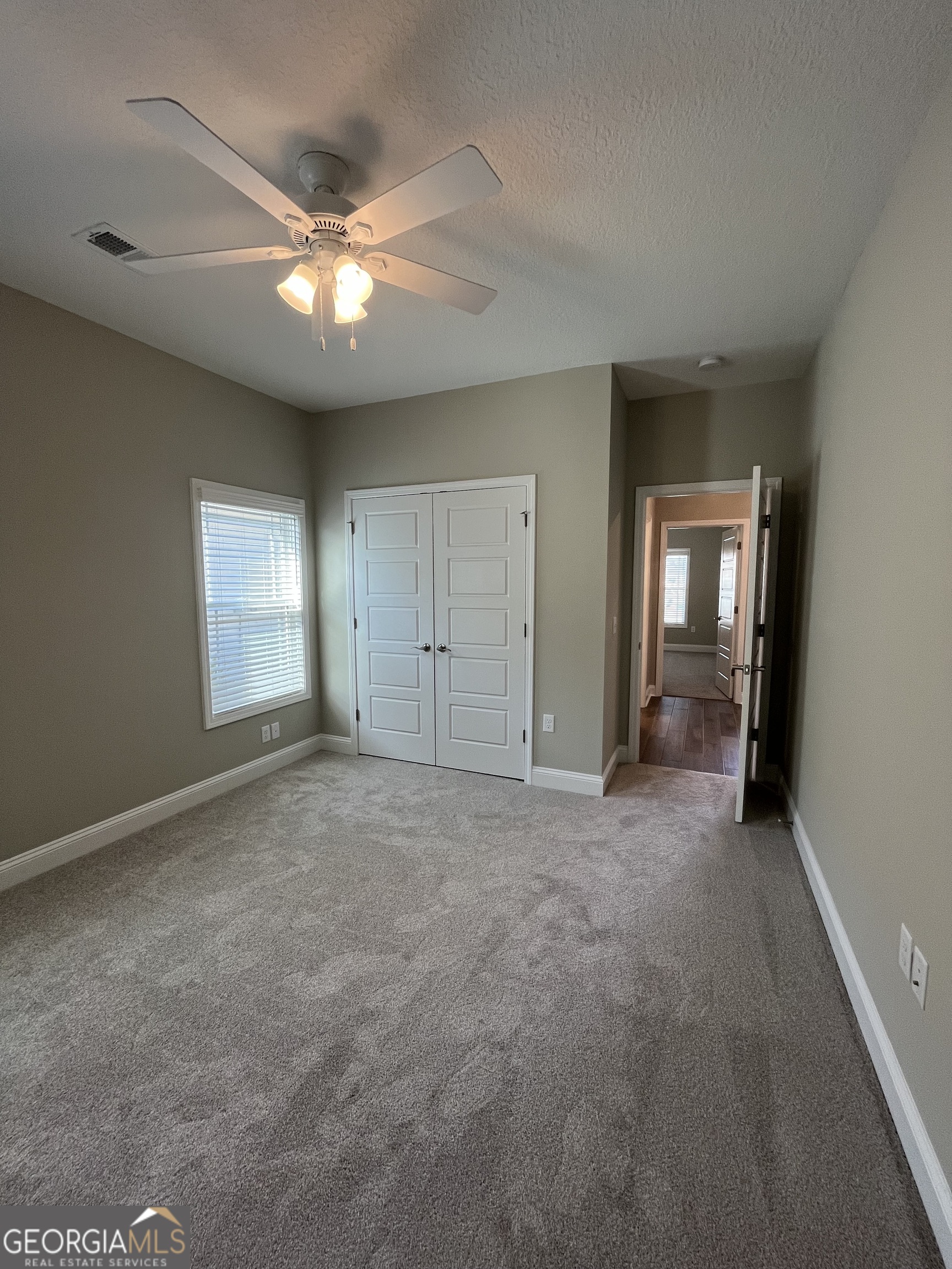 160 The Villas Way Kingsland, GA 31548 - Photo 16 of 65 a view of an empty room with window and cabinet