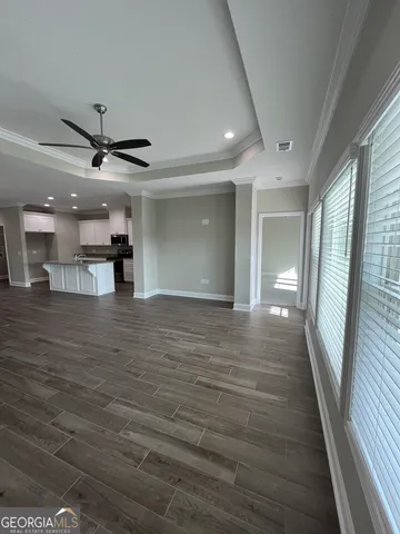a stove top oven sitting inside of a kitchen