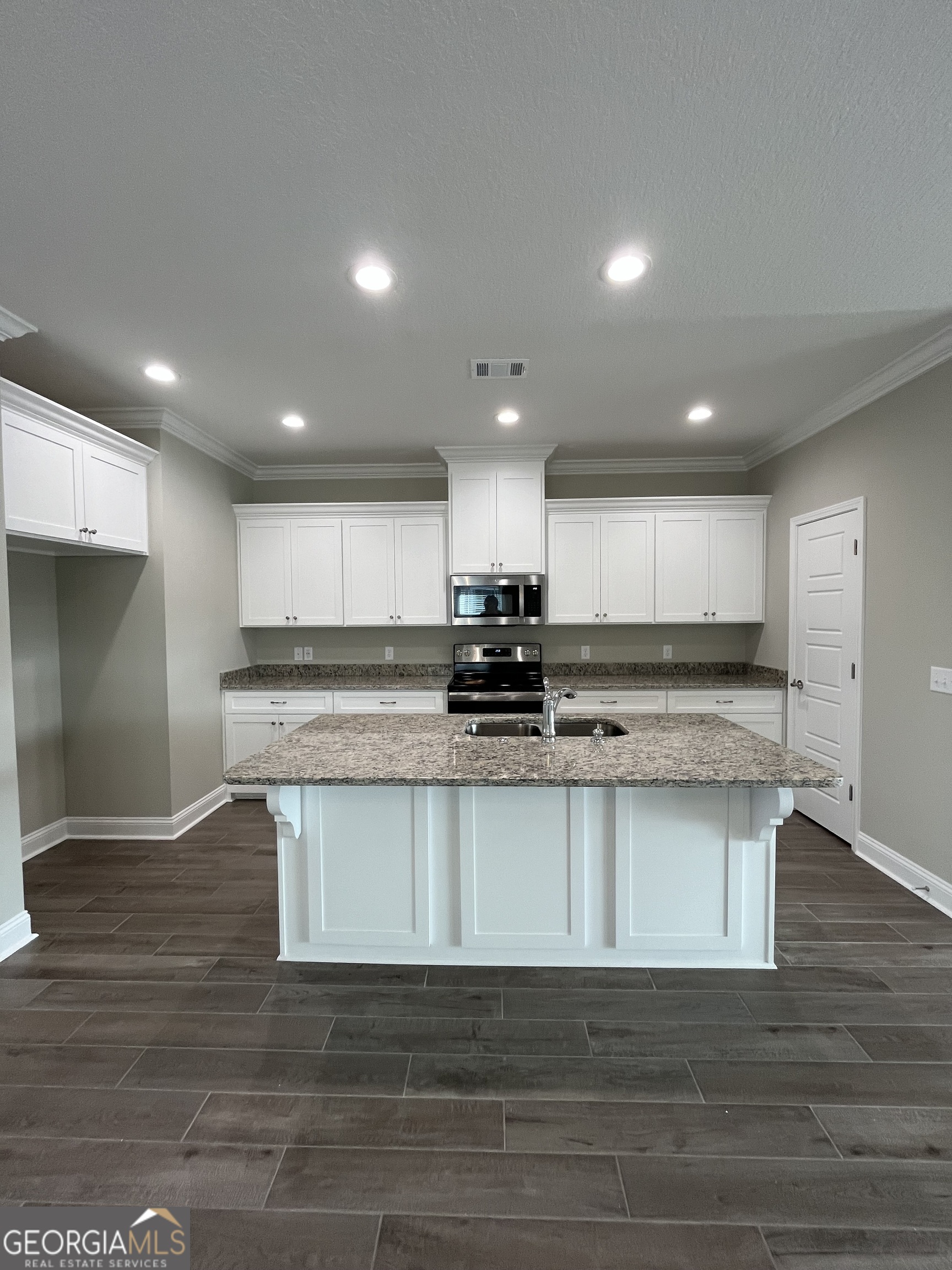 160 The Villas Way Kingsland, GA 31548 - Photo 29 of 65 a view of kitchen with stainless steel appliances granite countertop cabinets and wooden floor