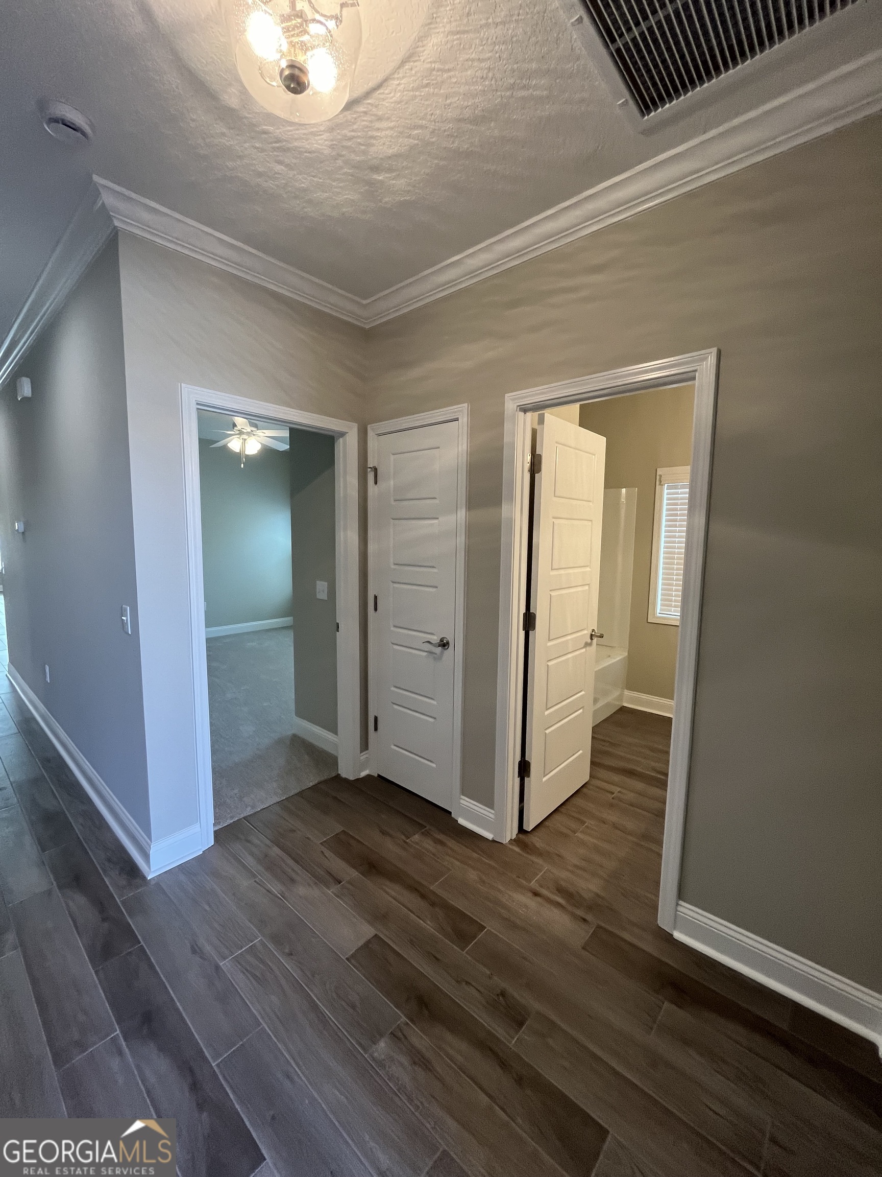 160 The Villas Way Kingsland, GA 31548 - Photo 3 of 65 an empty room with wooden floor and closet