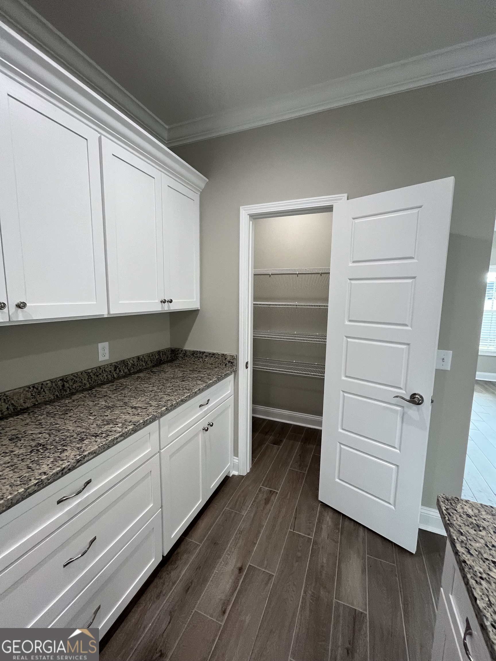 160 The Villas Way Kingsland, GA 31548 - Photo 34 of 65 a kitchen with granite countertop a cabinets and a stove top oven