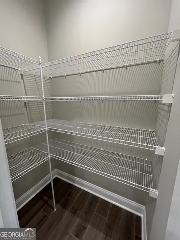 a bathroom with a glass door shower