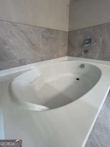 a view of a house with pool and sitting area