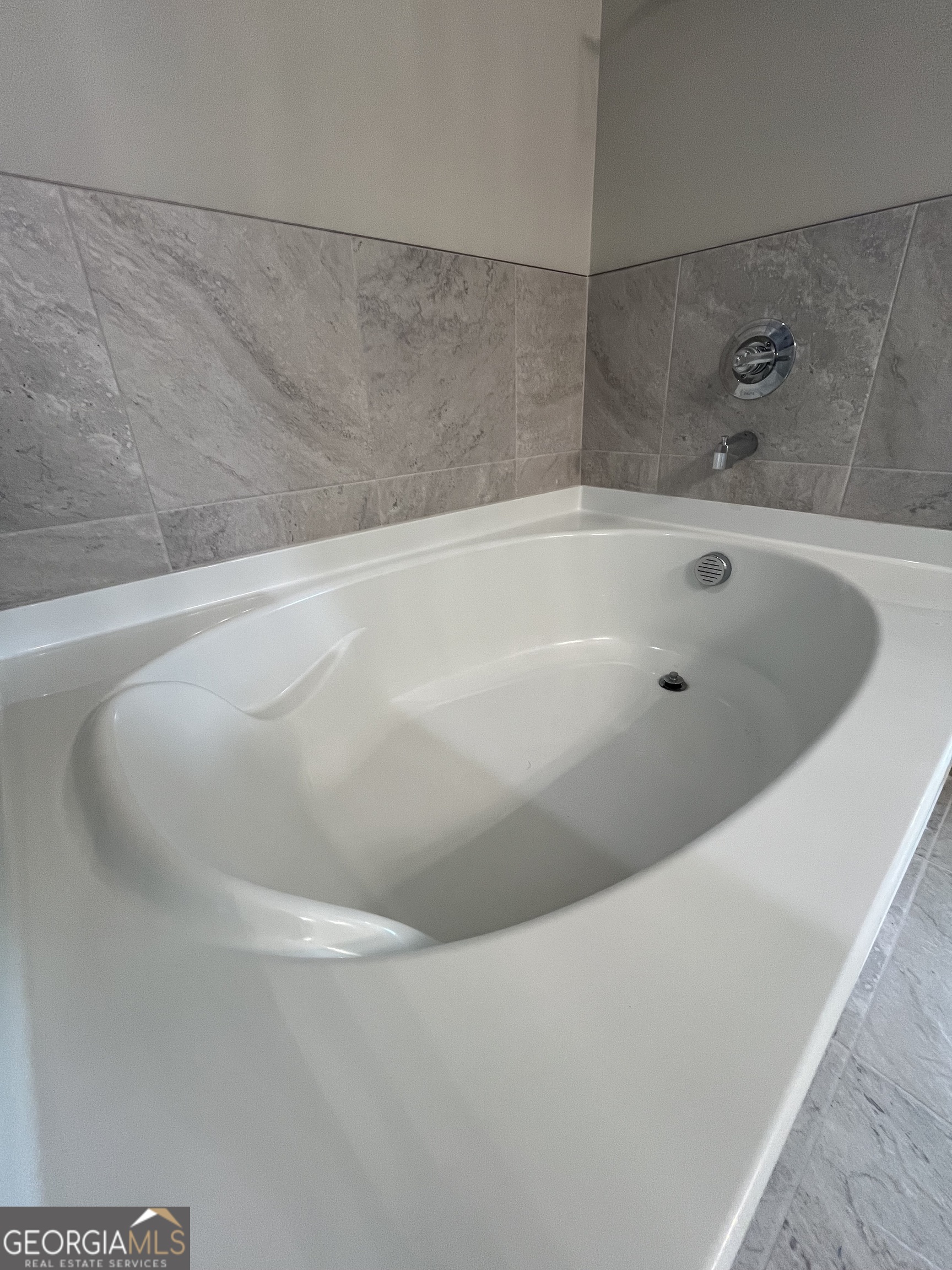 160 The Villas Way Kingsland, GA 31548 - Photo 42 of 65 a bath tub sitting in a bathroom