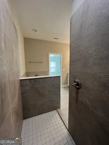 a view of yard with swimming pool and seating