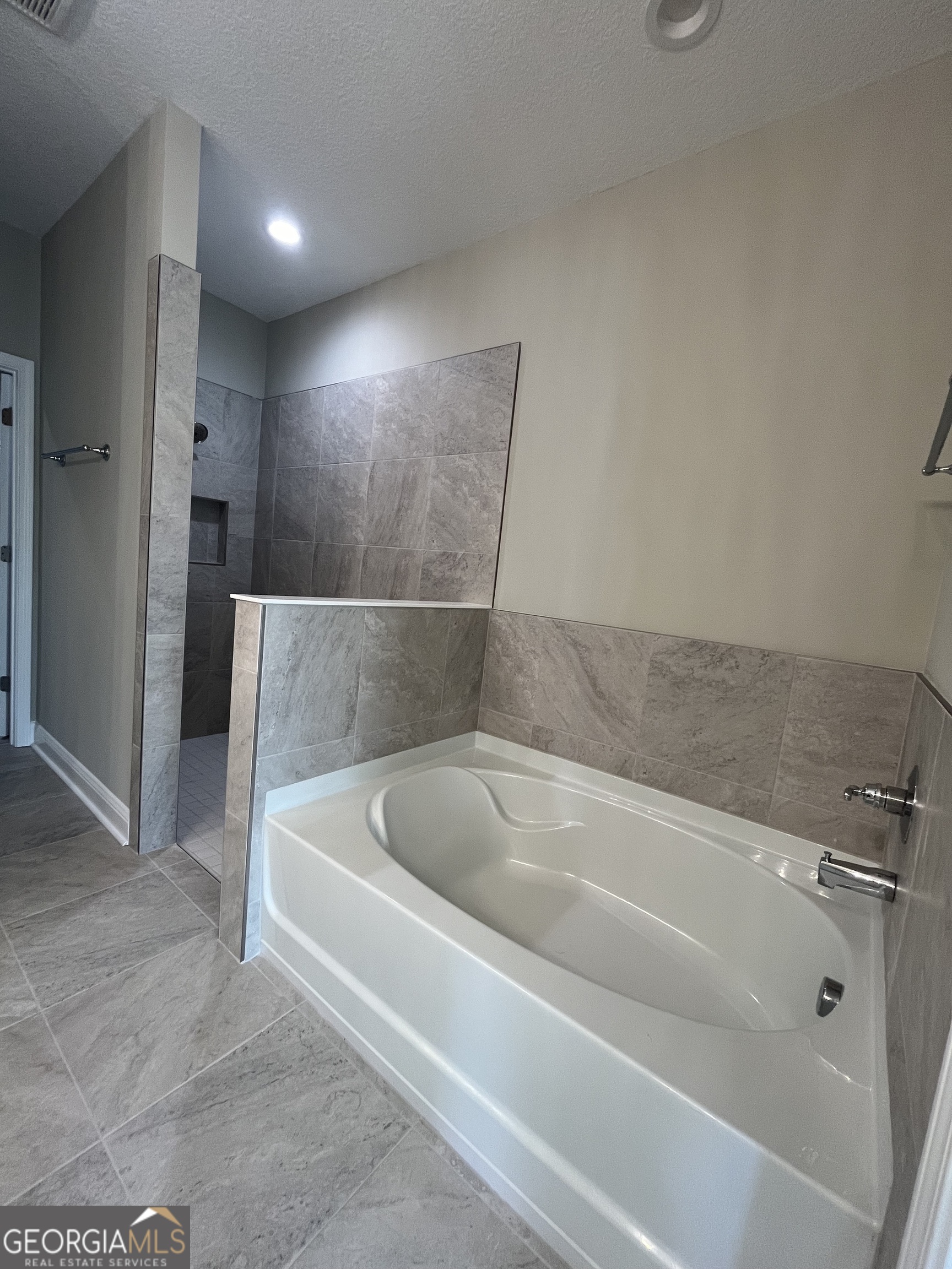 160 The Villas Way Kingsland, GA 31548 - Photo 47 of 65 a spacious bathroom with a bathtub and shower