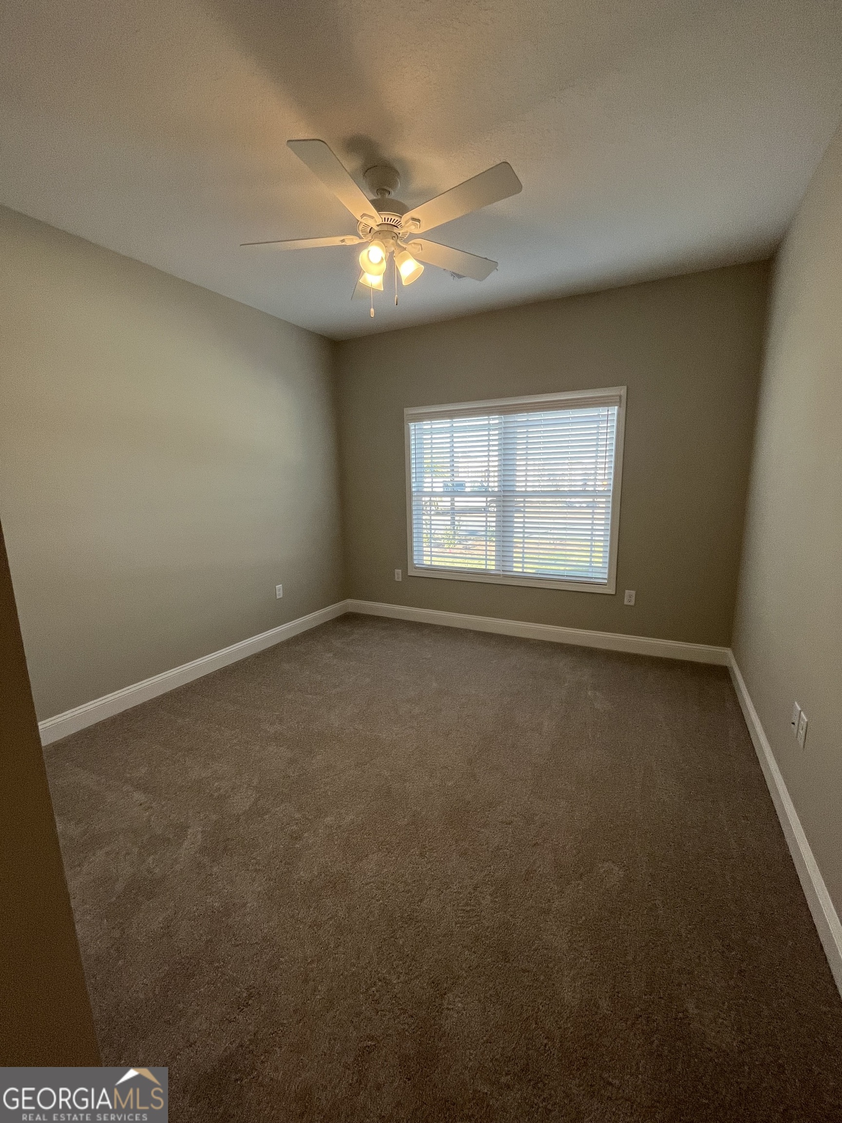 160 The Villas Way Kingsland, GA 31548 - Photo 5 of 65 an empty room with a window