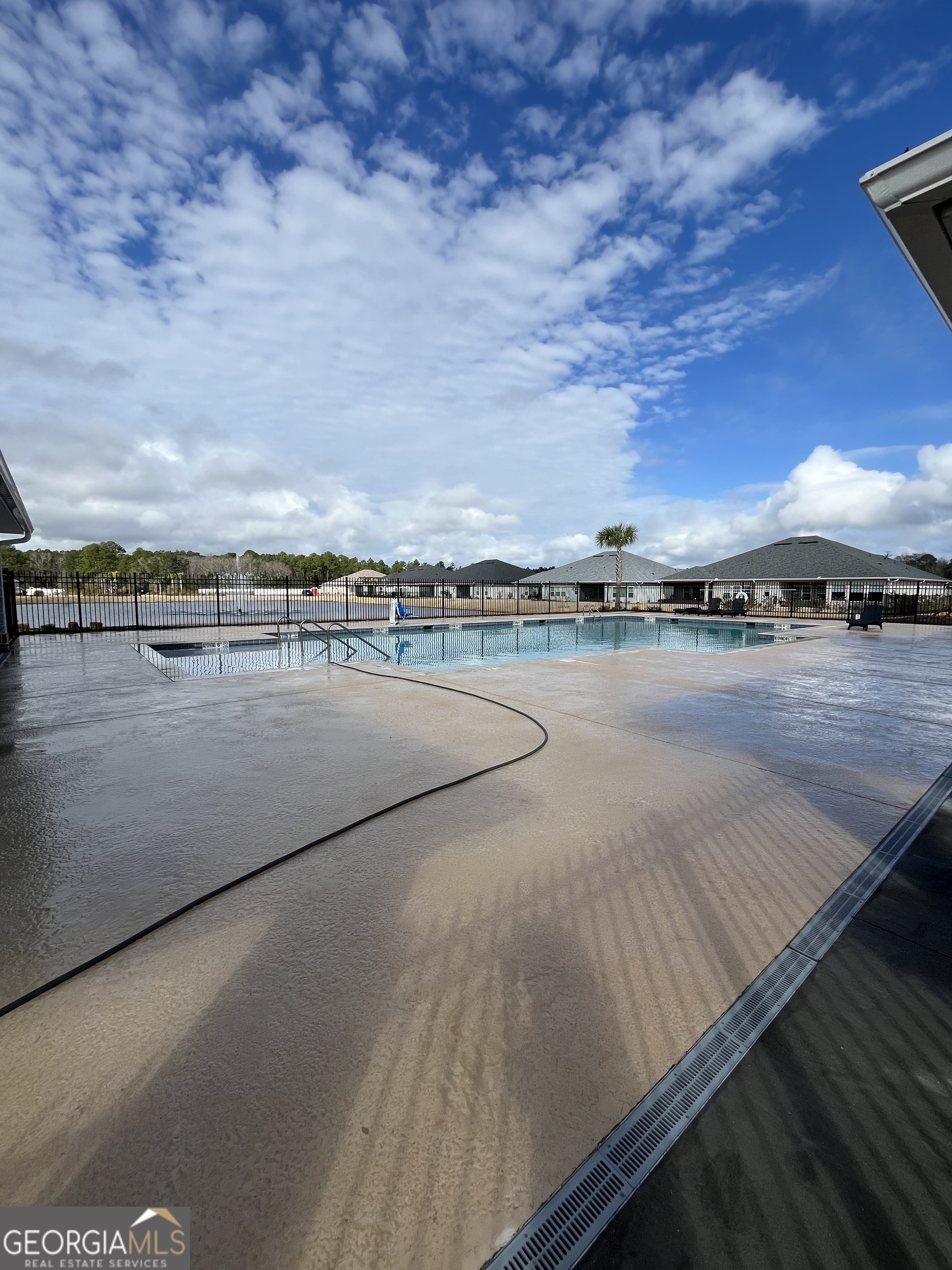 160 The Villas Way Kingsland, GA 31548 - Photo 62 of 65 a view of a swimming pool with an outdoor seating