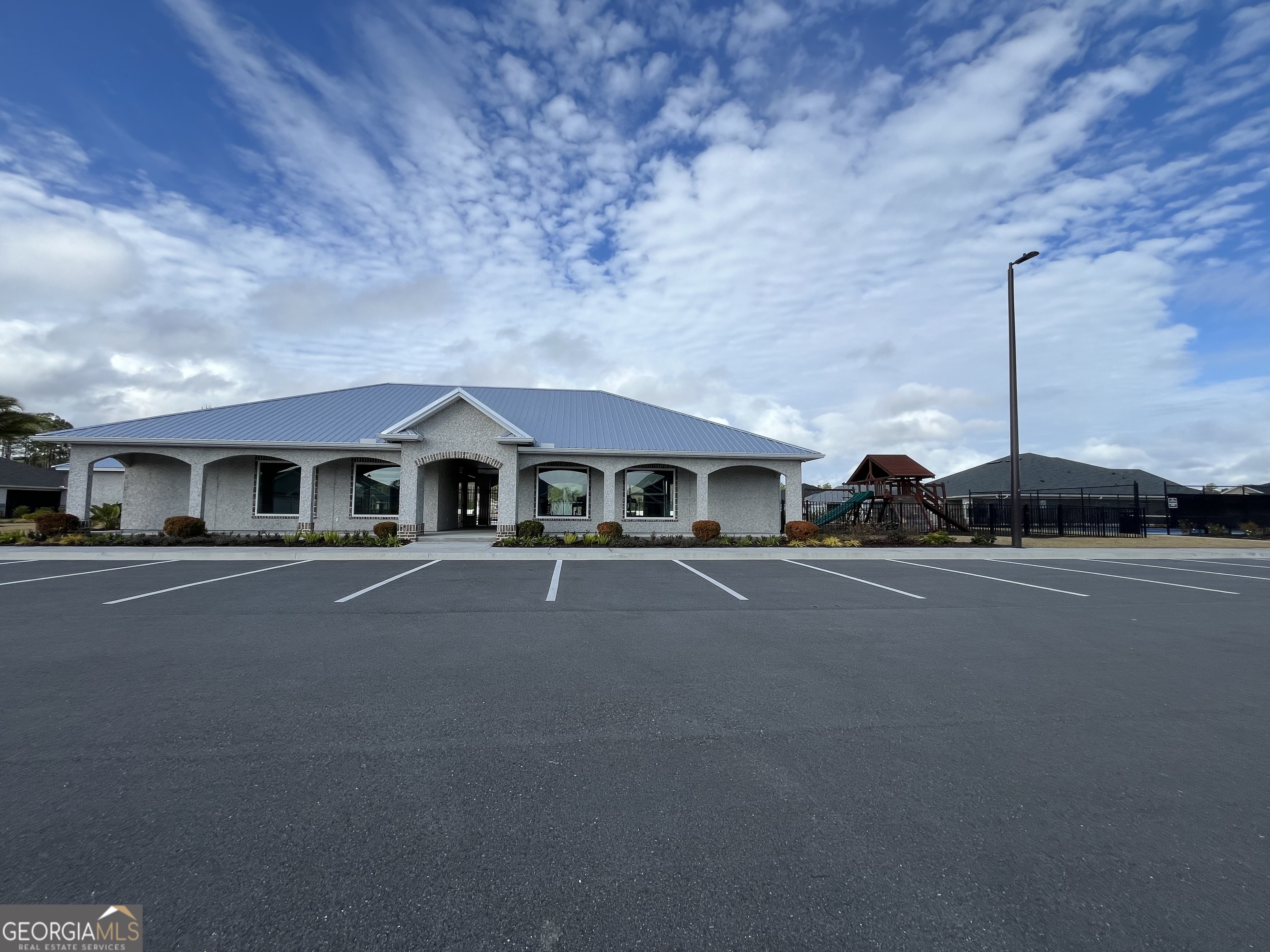 160 The Villas Way Kingsland, GA 31548 - Photo 63 of 65 a front view of a house with yard and parking