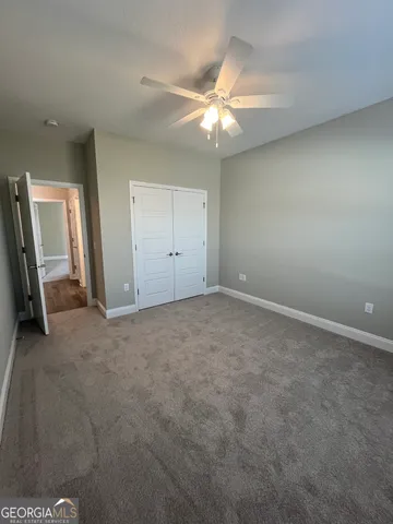 a bathroom with a double vanity sink and a toilet