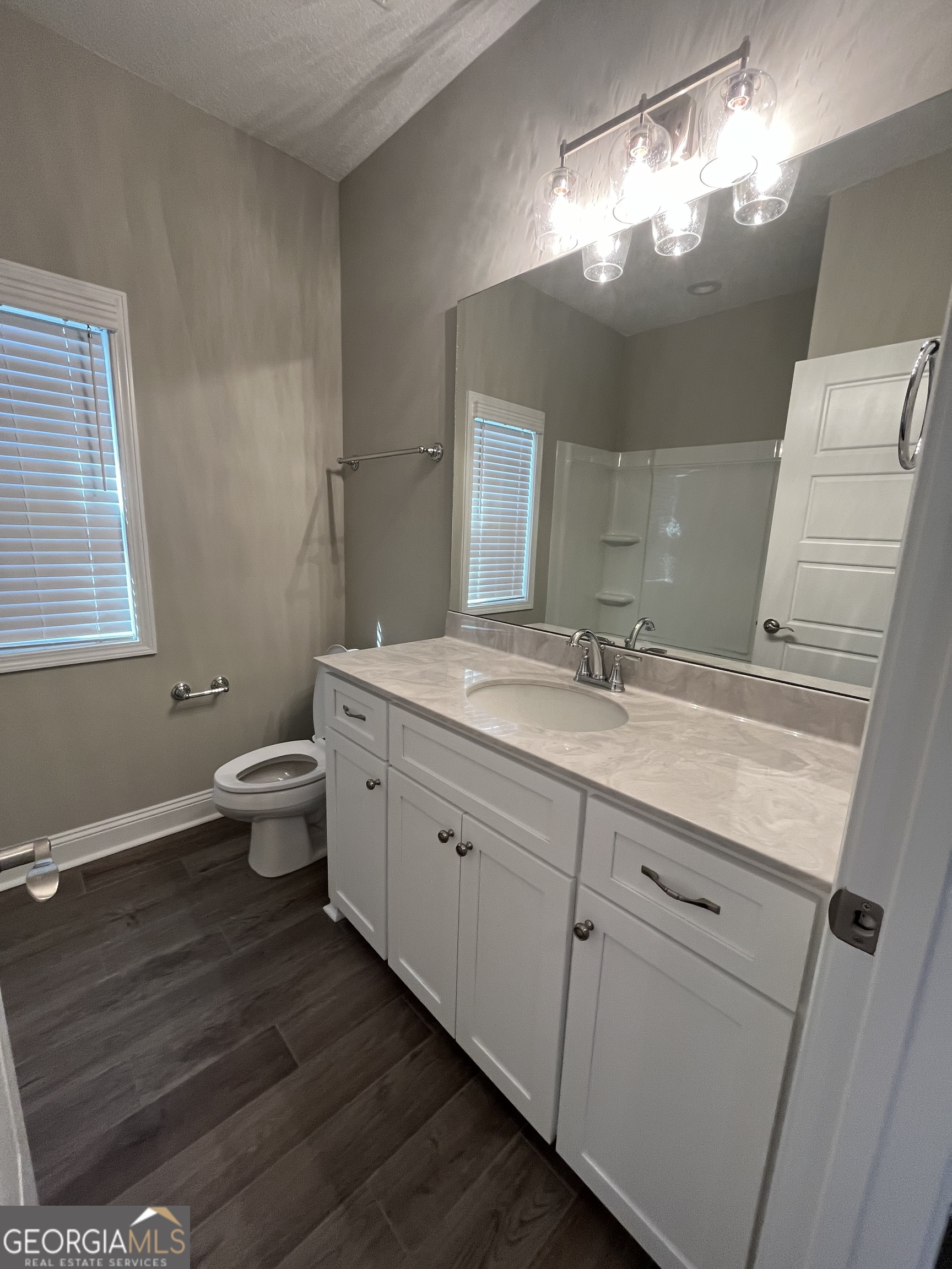 160 The Villas Way Kingsland, GA 31548 - Photo 9 of 65 a bathroom with a double vanity sink and a toilet