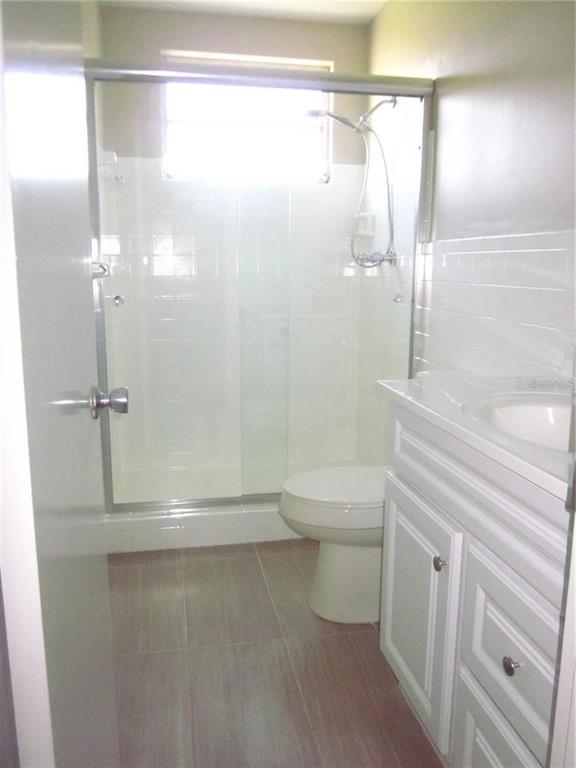 2456 Ecuadorian Way, Unit 46 Clearwater, FL 33763 - Photo 12 of 65 a bathroom with a shower a toilet and a sink