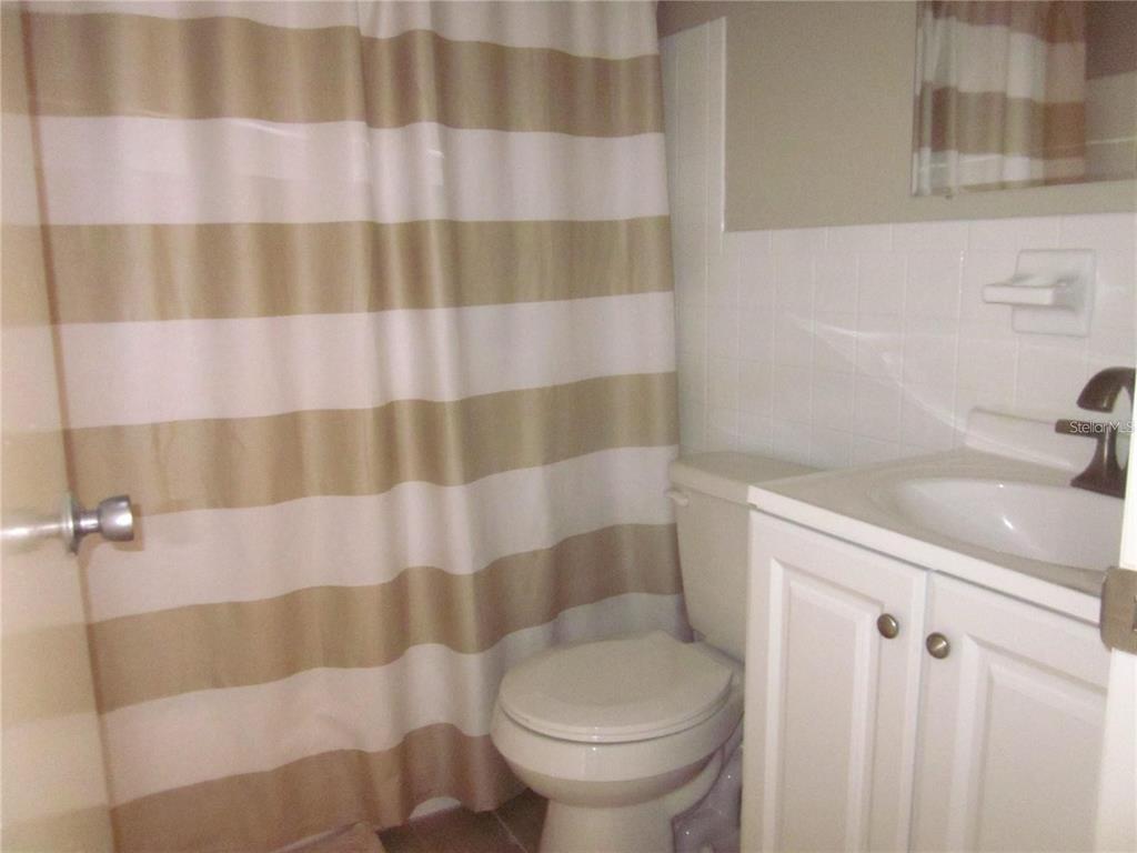 2456 Ecuadorian Way, Unit 46 Clearwater, FL 33763 - Photo 14 of 65 a bathroom with a sink toilet and shower