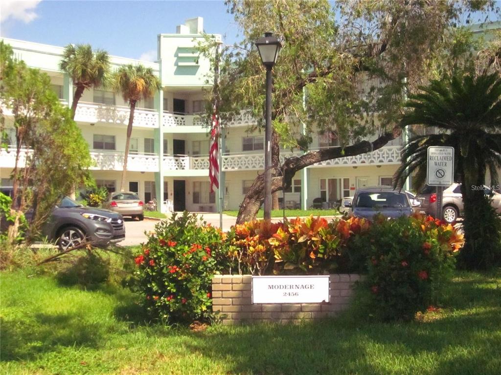 2456 Ecuadorian Way, Unit 46 Clearwater, FL 33763 - Photo 2 of 65 a view of a house with a yard and sitting area