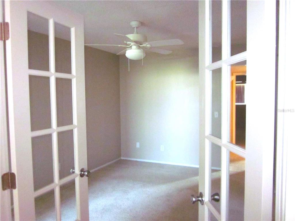 2456 Ecuadorian Way, Unit 46 Clearwater, FL 33763 - Photo 9 of 65 a view of an empty room with a window