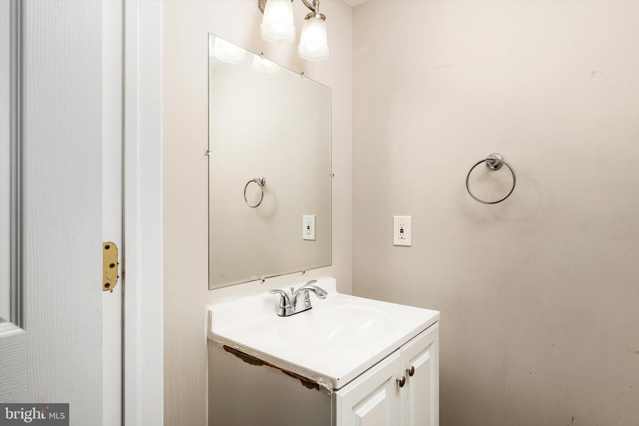 355 Leonard Avenue Hamilton, NJ 08619 - Photo 15 of 34 a bathroom with a sink and a mirror