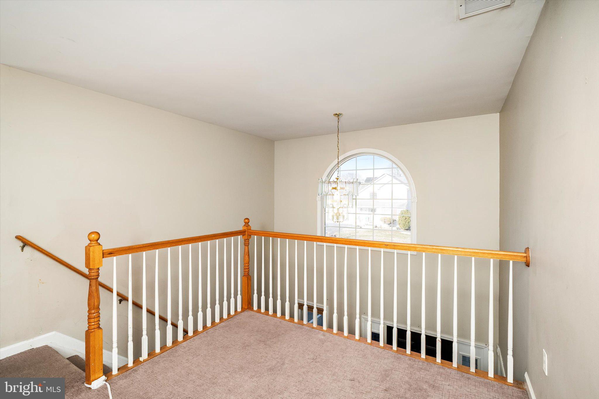 355 Leonard Avenue Hamilton, NJ 08619 - Photo 17 of 34 a view of staircase with floor to ceiling window