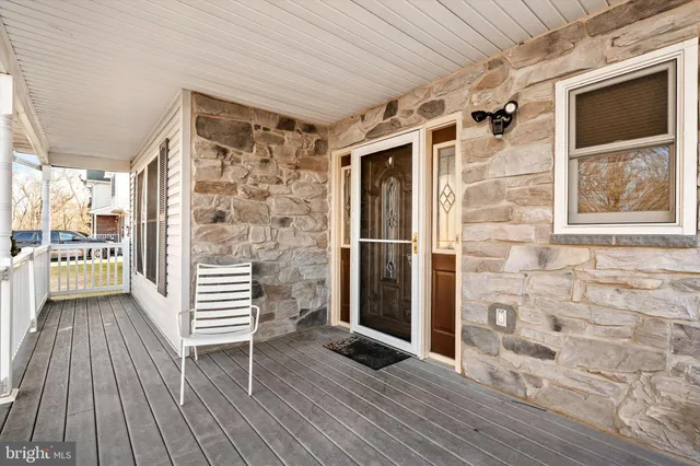 a view of outdoor space with wooden floor and door
