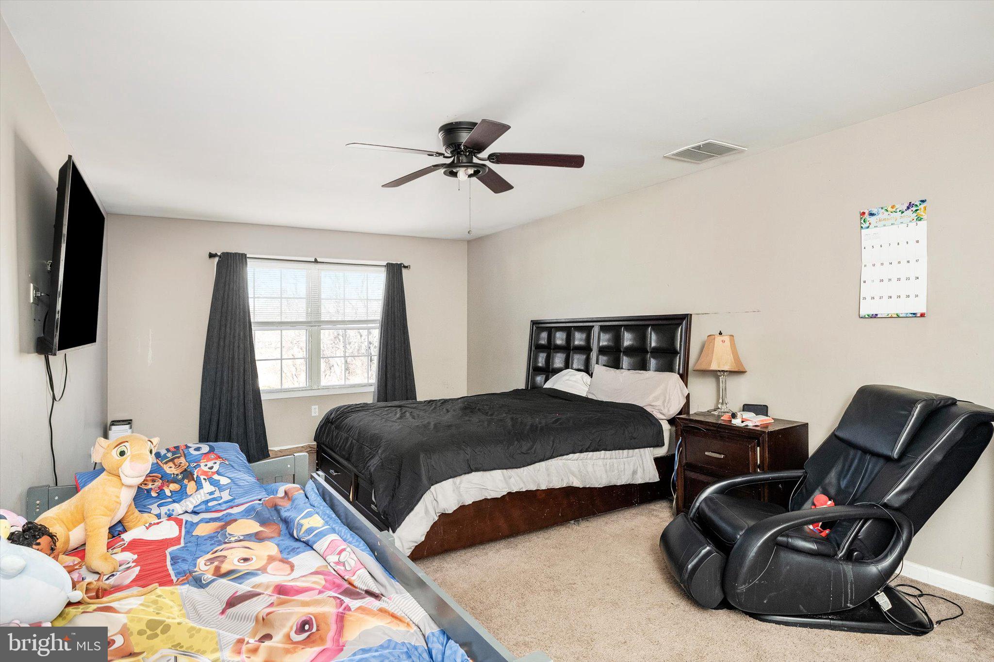 355 Leonard Avenue Hamilton, NJ 08619 - Photo 23 of 34 a bedroom with two beds and a window