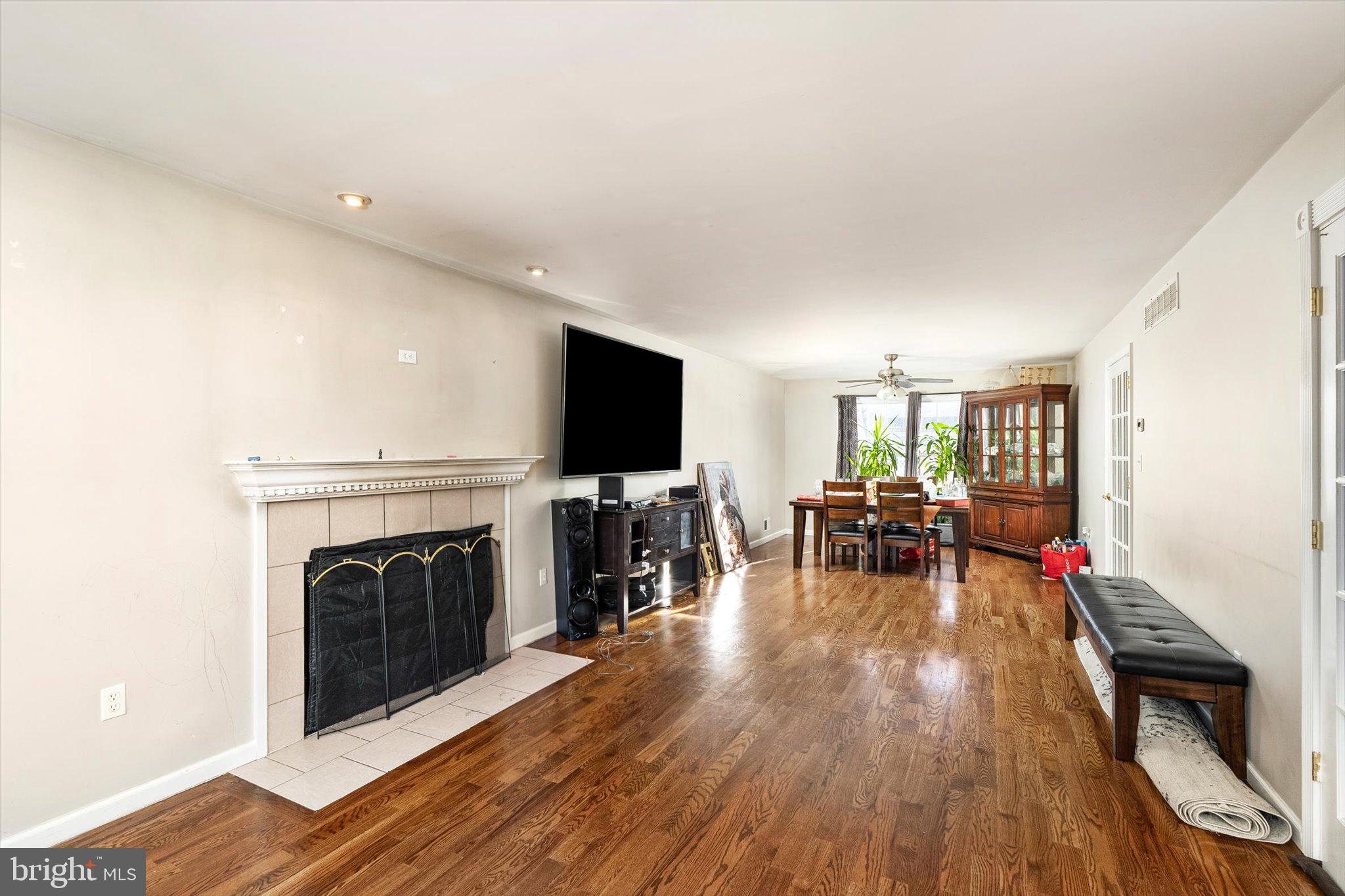 355 Leonard Avenue Hamilton, NJ 08619 - Photo 5 of 34 a living room with furniture and a fireplace