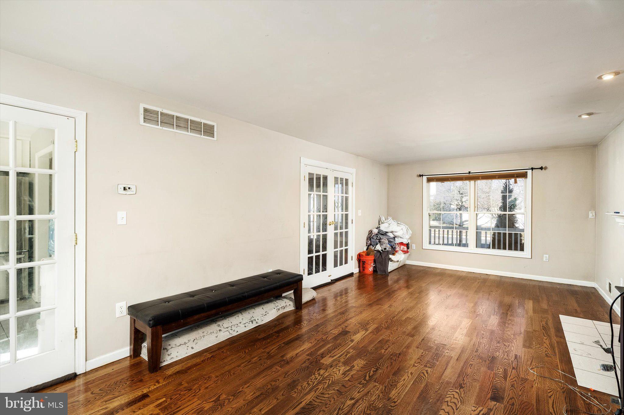355 Leonard Avenue Hamilton, NJ 08619 - Photo 6 of 34 a living room with furniture and a wooden floor