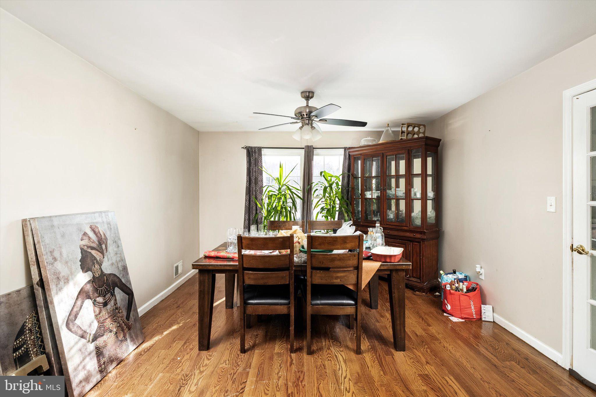 355 Leonard Avenue Hamilton, NJ 08619 - Photo 7 of 34 a dining room with furniture window and wooden floor