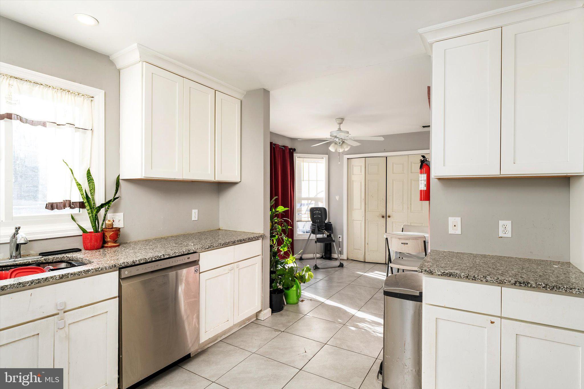 355 Leonard Avenue Hamilton, NJ 08619 - Photo 9 of 34 a kitchen with a sink cabinets and window