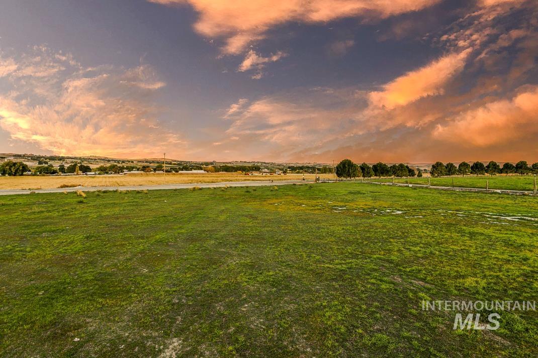 View of green lawn featuring a rural view